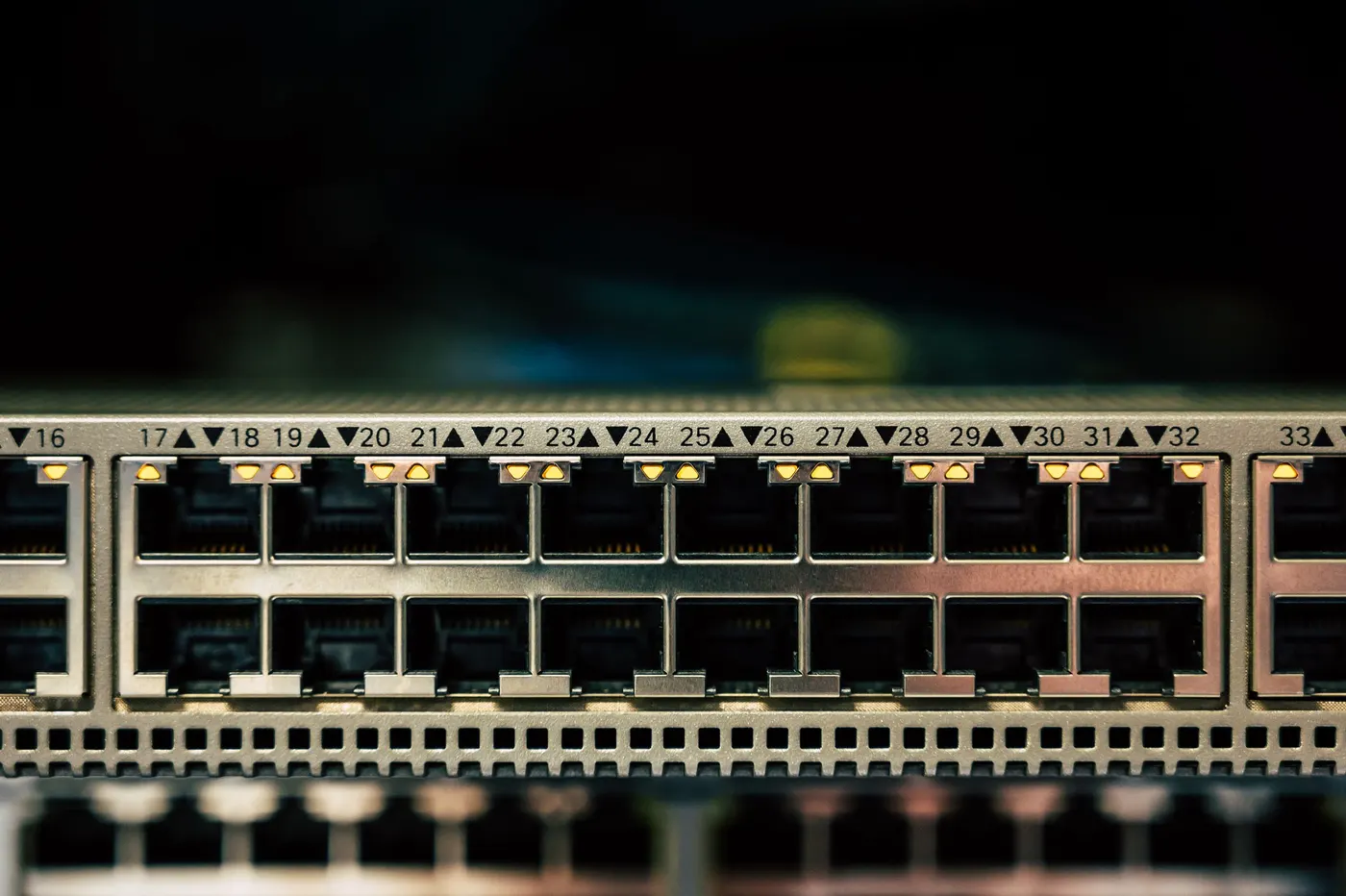 Close-up of network switch RJ45 ports with status LEDs