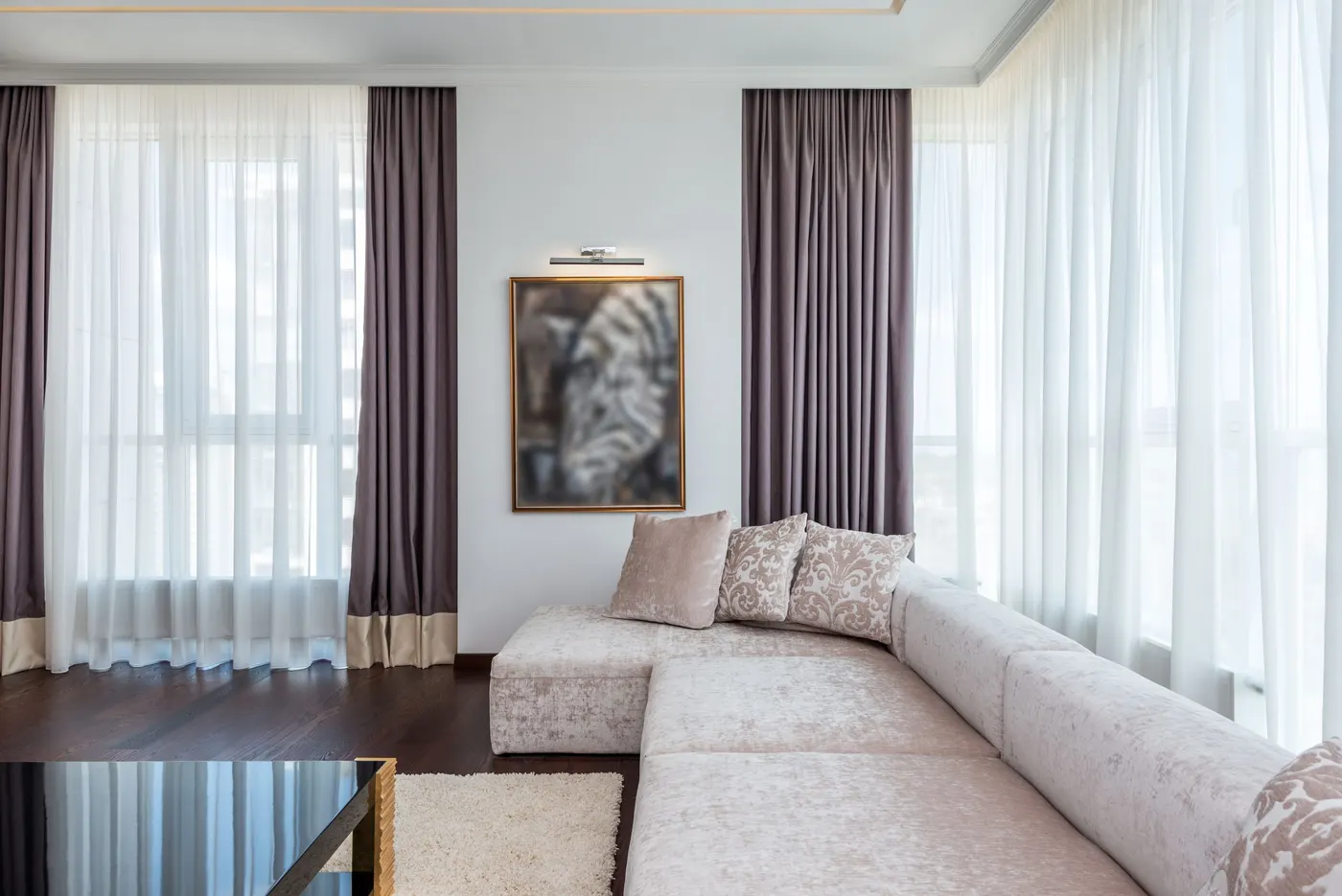 Bright living room with floor-length curtains and sheers